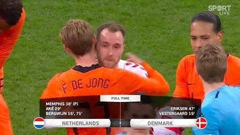 The Dutch and Danish players embrace Christian Eriksen after his brilliant return for Denmark.